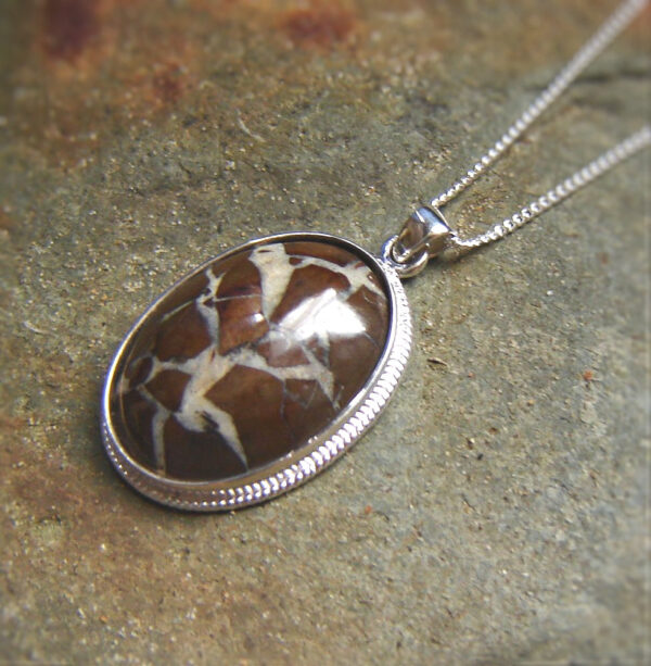 Brown Natural Stone Necklace with White Quartz Veins. Pendant necklace in a natural stone, which has been collected in the Northumbria region of England, Britain. Natural Stone Necklaces from Northumbria Gems.