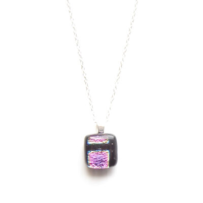 Small modernist pendant handmade in patterned fused glass with dichroic pink metallic squares