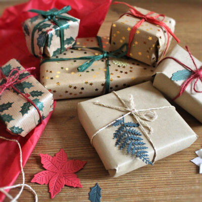 Gift wrapping option (add on) from Northumbria Gems. Gift boxes wrapped in natural kraft paper, gold stars wrapping and traditional Christmas holly wrap, with coloured ties.