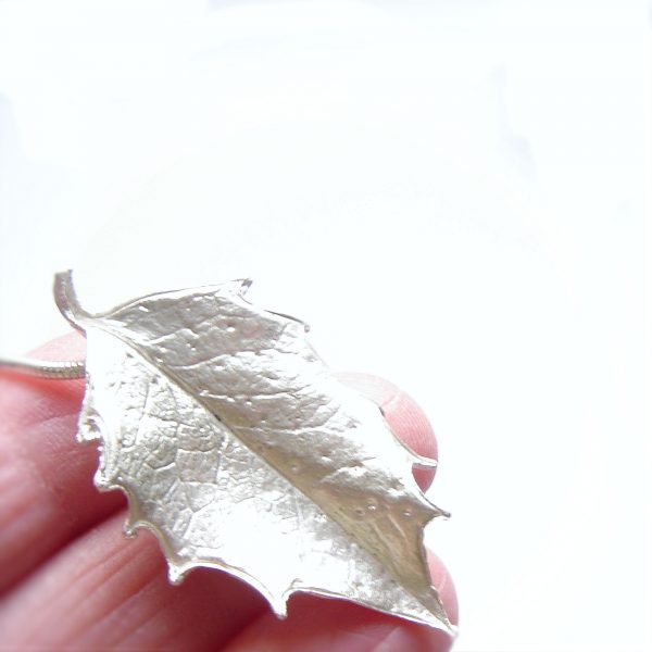 Large silver holly leaf necklace, handcrafted in ethical silver with fine detail from a real holly leaf. Made in England.