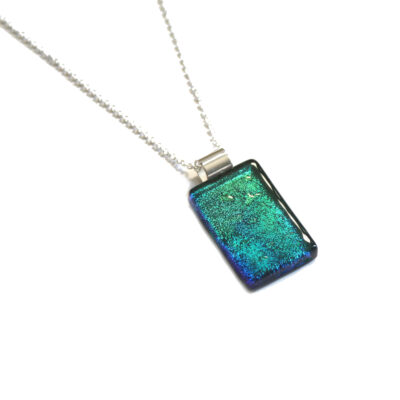 Northern Lights Rolled Bail Pendant handmade in iridescent blues dichroic fused glass.