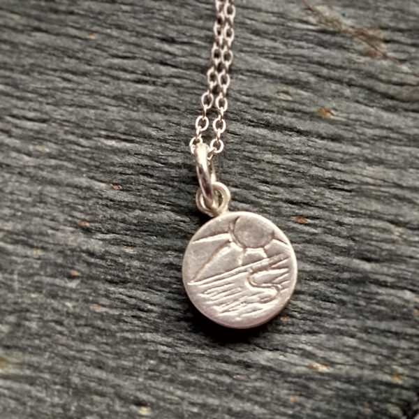 Coastal Scene Silver Necklace, tiny round pendant handmade in ethical silver by Northumbria Gems.