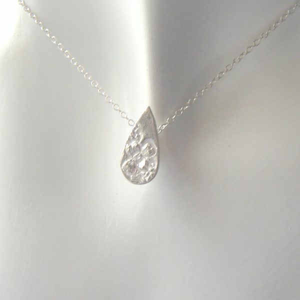 Silver Tormentil Wildflower Necklace, small wildflower teardrop pendant from Northumbria Gems.