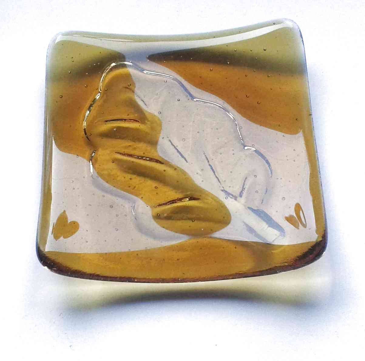 Amber glass leaf jewellery dish. This small jewellery or trinket bowl is handcrafted individually in dark amber glass. Made in north-east England.