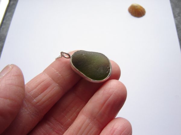 Man's or woman's green sea glass bezel pendant