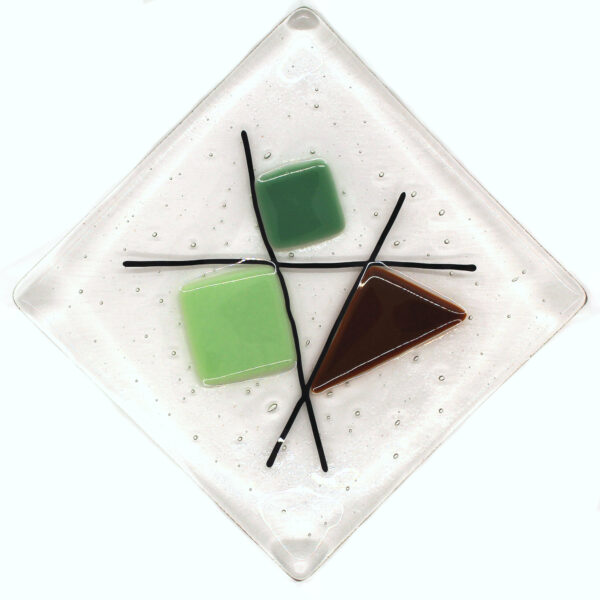 Geometric glass dish tan and mint greens on clear. This retro dish is made in a sixties-inspired design featuring geometric shapes intersected with black lines. Handcrafted using fused glass techniques. Made in England.