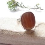 Large, handcrafted carnelian agate gemstone ring in sterling silver.