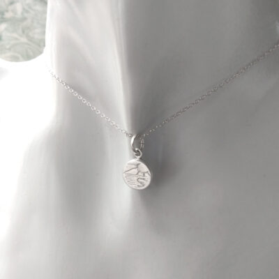 Coastal Scene Silver Necklace, tiny round pendant handmade in ethical silver by Northumbria Gems.